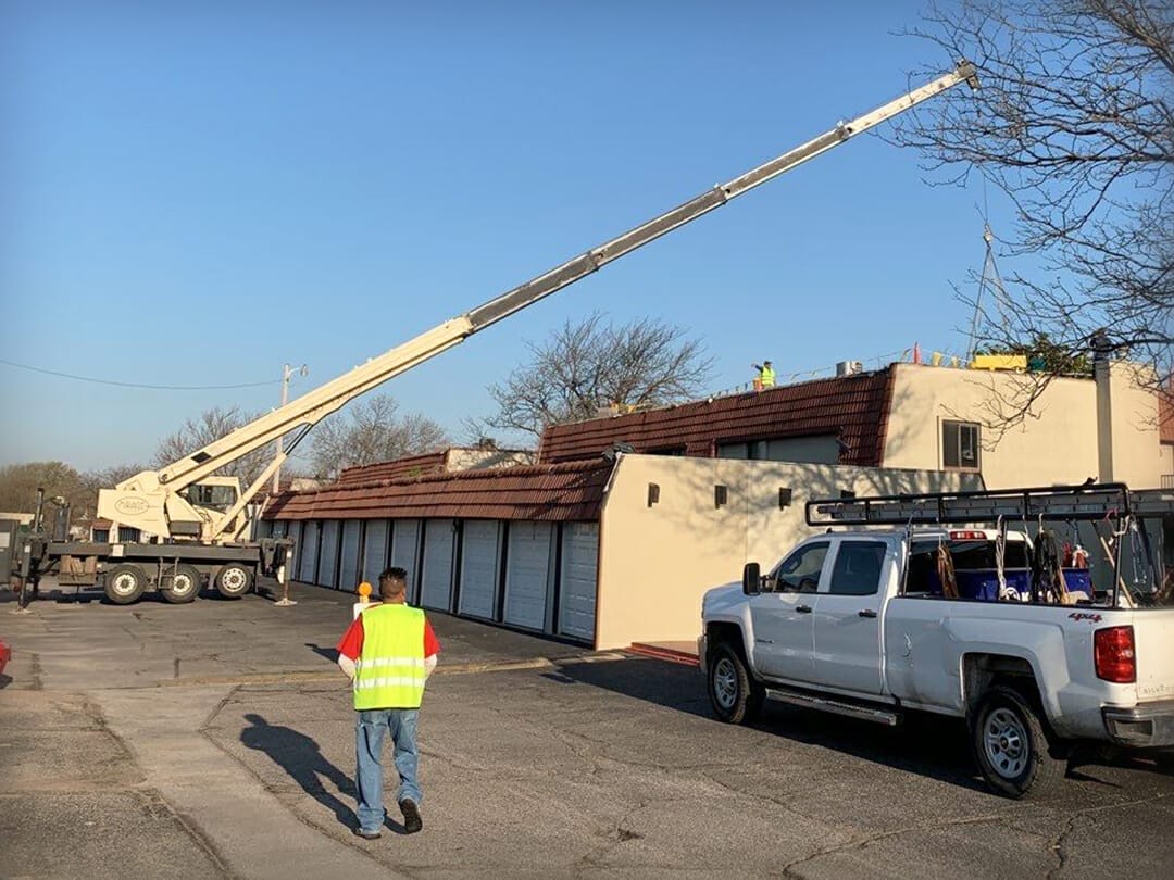 Crane Loading for Multifamily Apartment Roofing Project - Rhoden Roofing